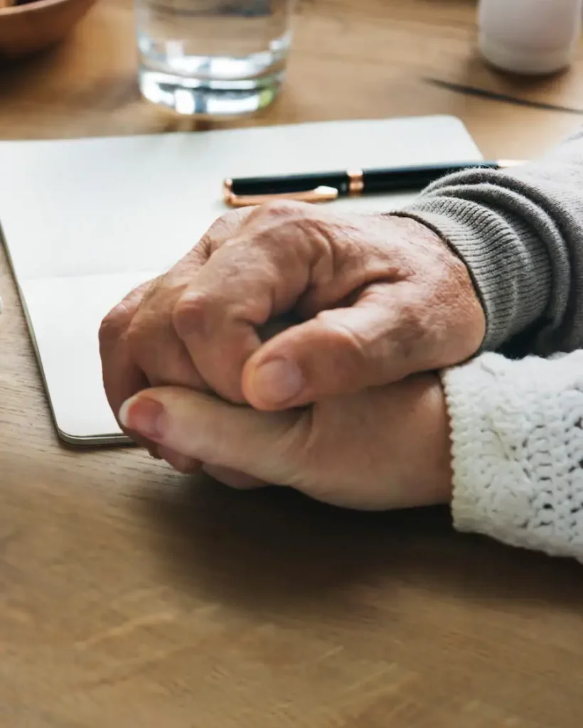 senior-married-coupple-comforting-each-other-holding-hands